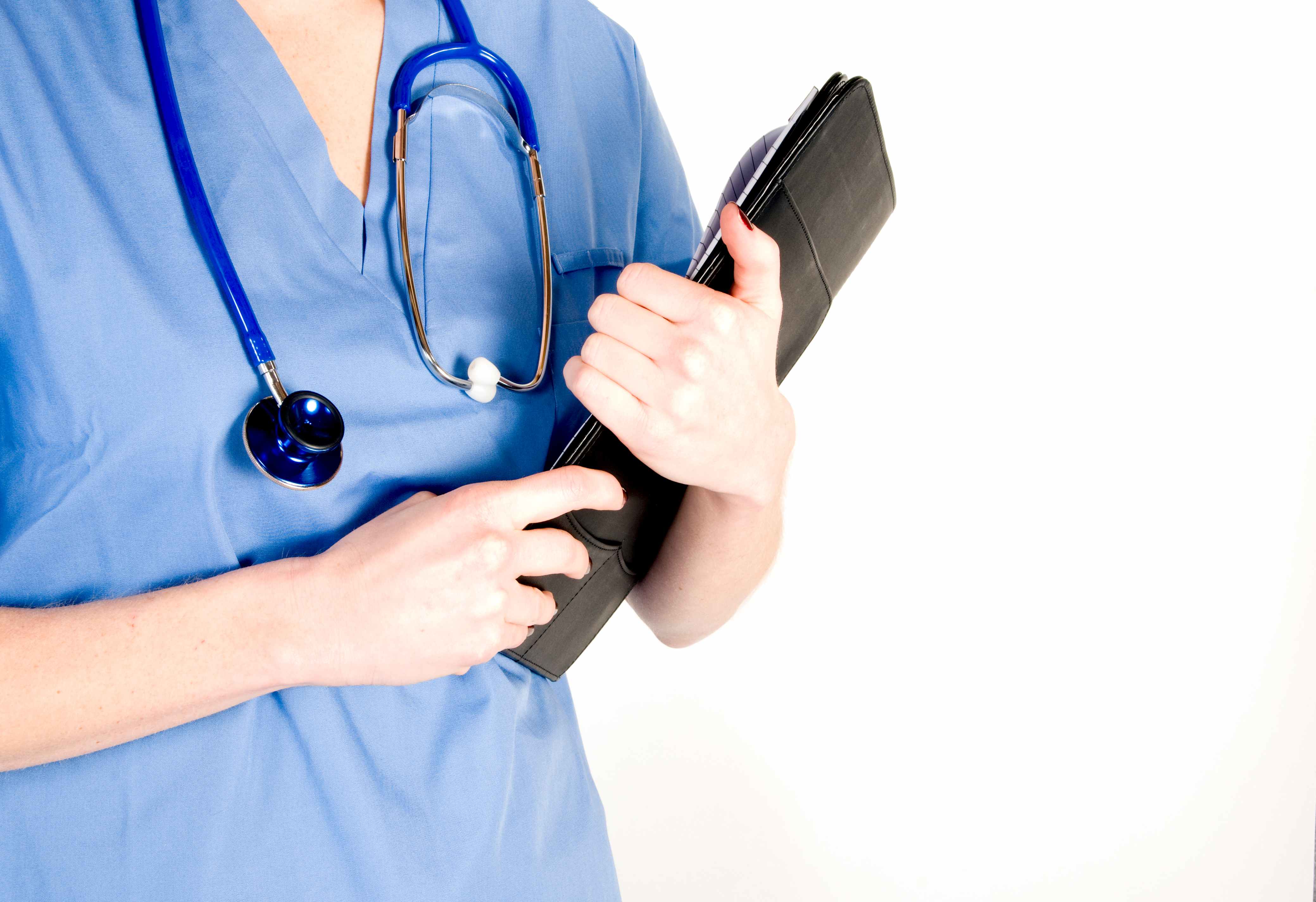 A healthcare worker stands with a stethoscope around her neck, to show the qualities to look for