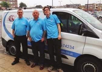 Kingdom cleaning team stood in front of a cleaning van