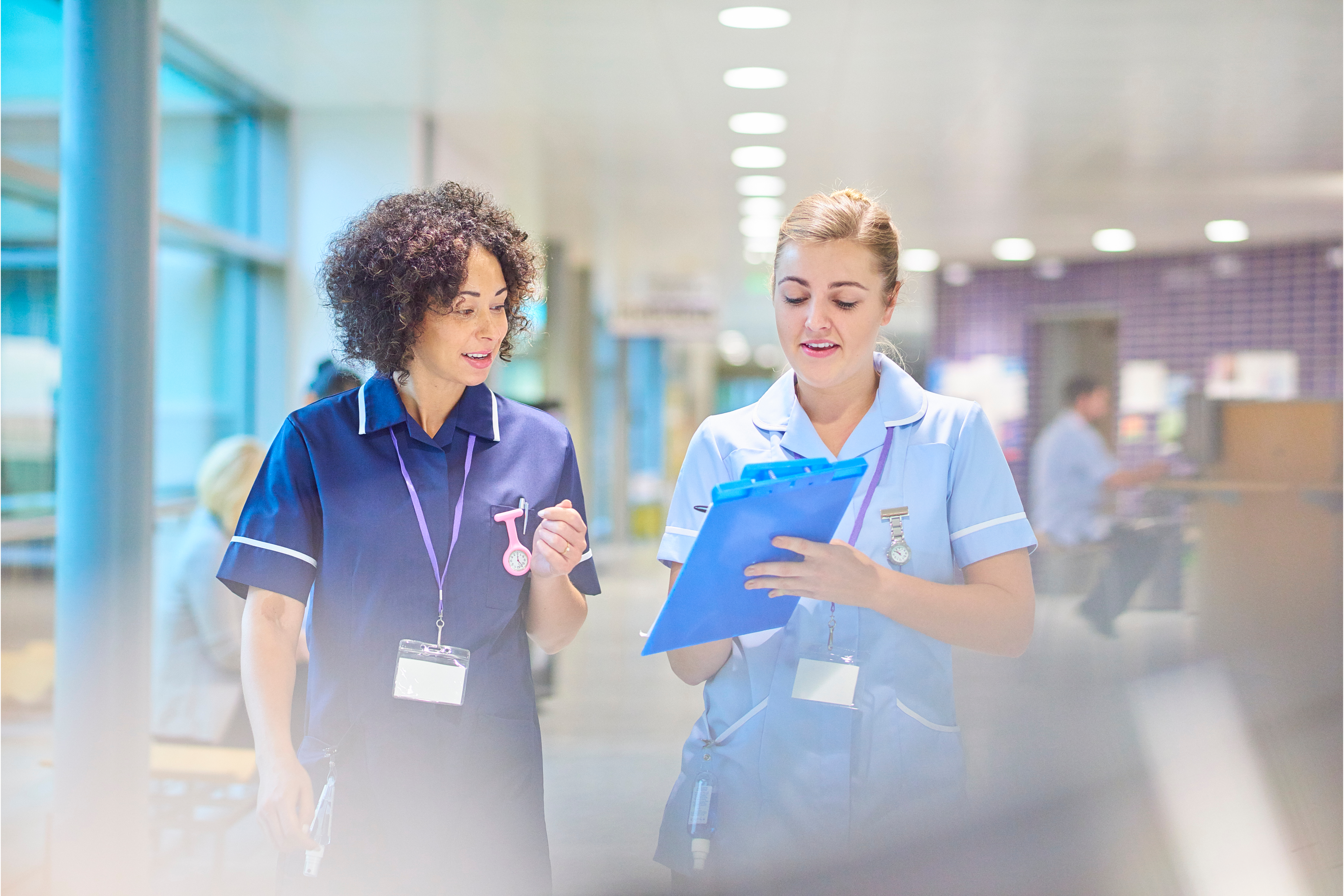 two nurses in a hospital to show the difference between personal support workers and nhs support workers