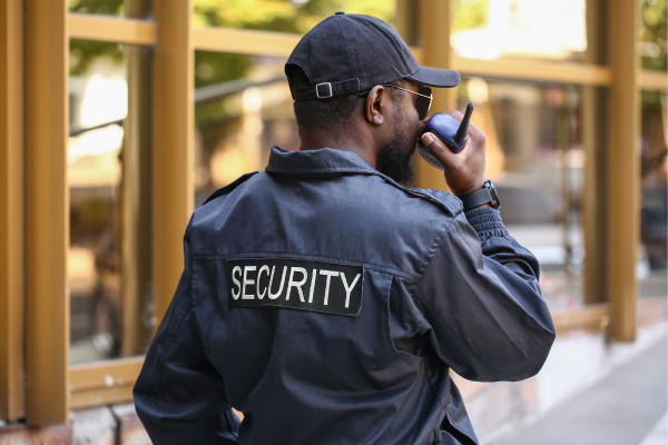 A security officer partaking in manned guarding to prevent and deter crime.